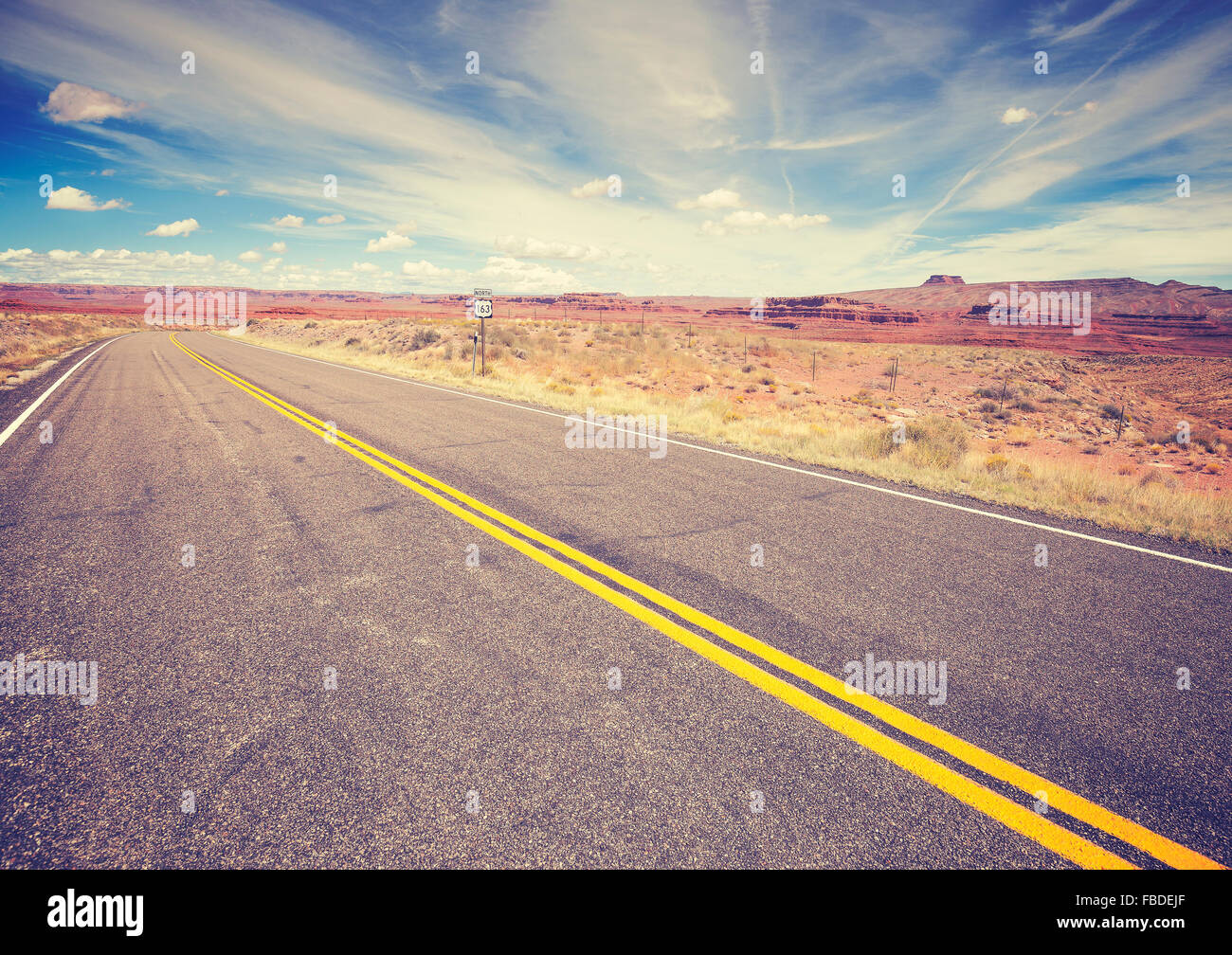 Vintage stylized endless country highway, USA. Stock Photo