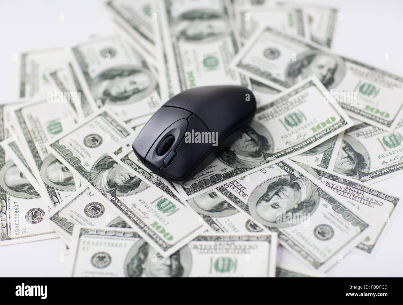 close up of computer mouse and dollar cash money Stock Photo