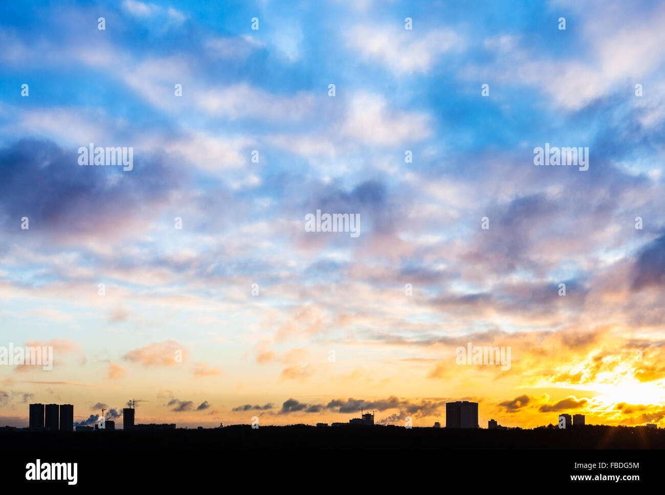 blue sunset sky with clouds over urban houses in winter Stock Photo - Alamy