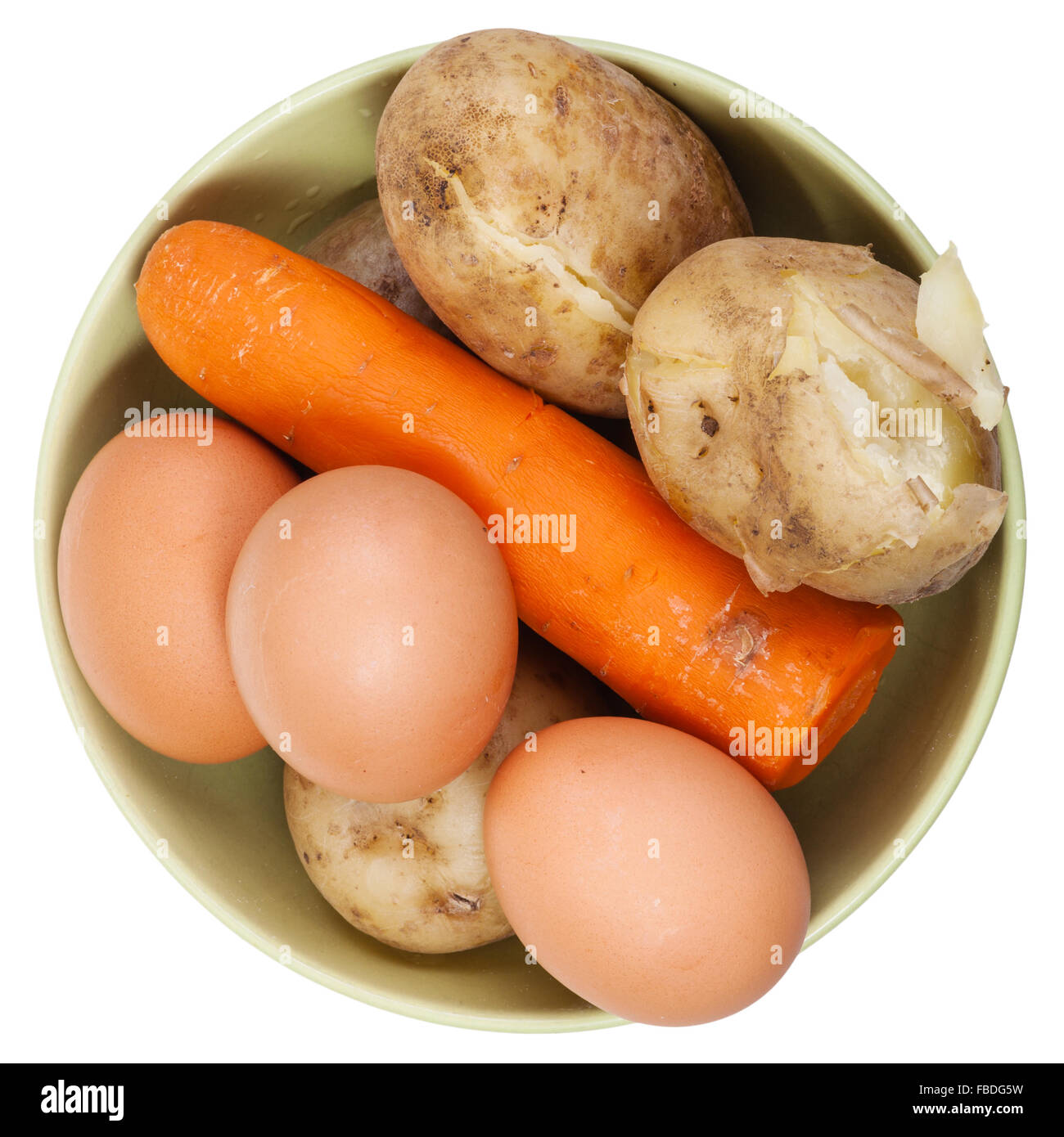 above view of boiled eggs, carrot and potatoes in a ceramic bowl isolated on white background