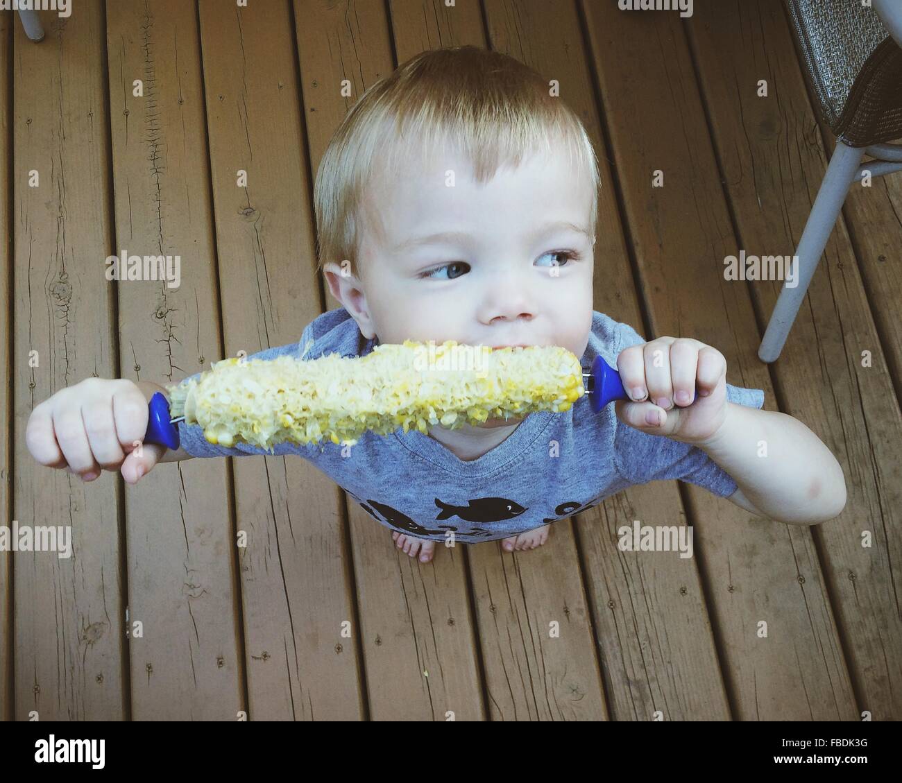 Boy biting food hi-res stock photography and images - Alamy