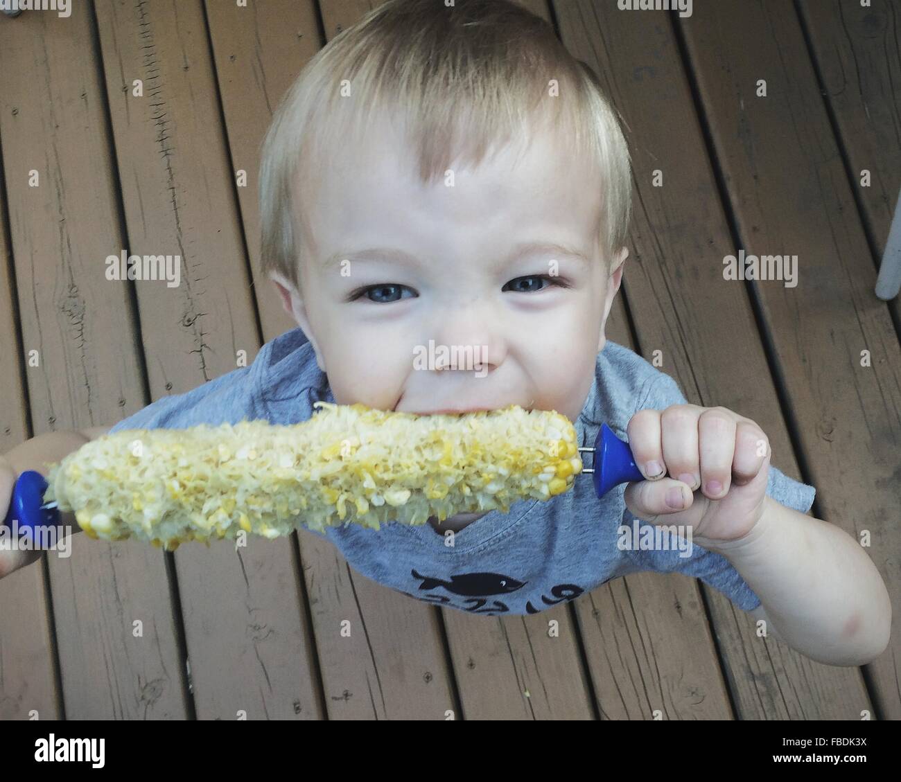 Boy biting food hi-res stock photography and images - Alamy