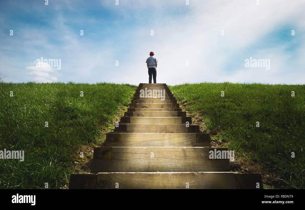 Boy Standing On Steps Stock Photo - Alamy