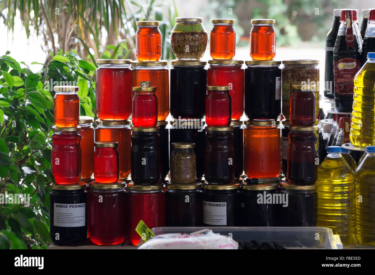 Stacked Honey And Oil Bottles For Sale At Street Market Stock Photo Alamy