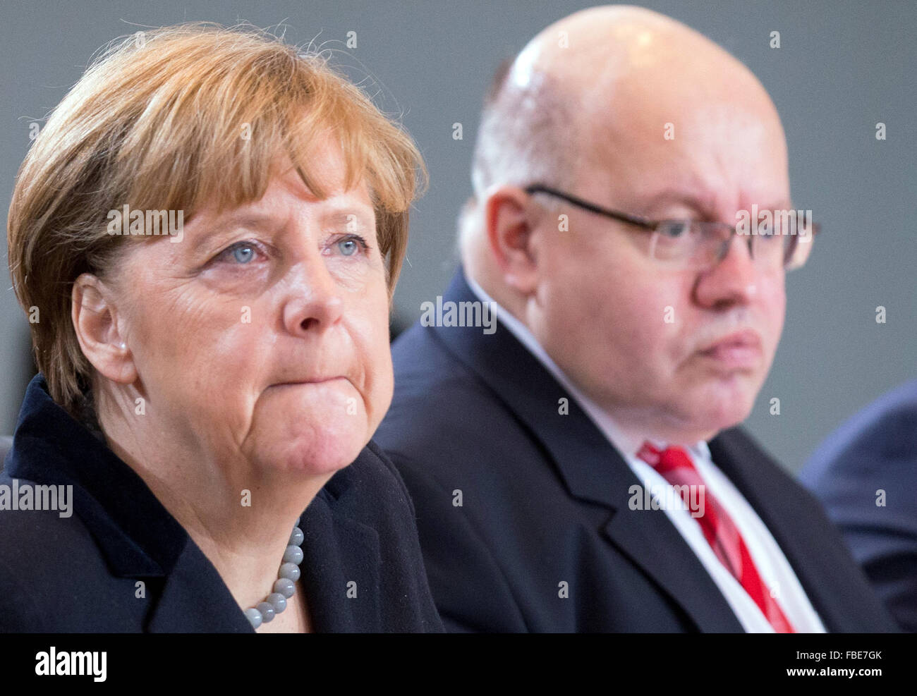German Chancellor Angela Merkel and Peter Altmaier, Chief of Staff of the German Chancellery, attend the federal cabinet meeting in the Federal Chancellery in Berlin, Germany, 13 January 2016. Photo: KAY NIETFELD/dpa Stock Photo