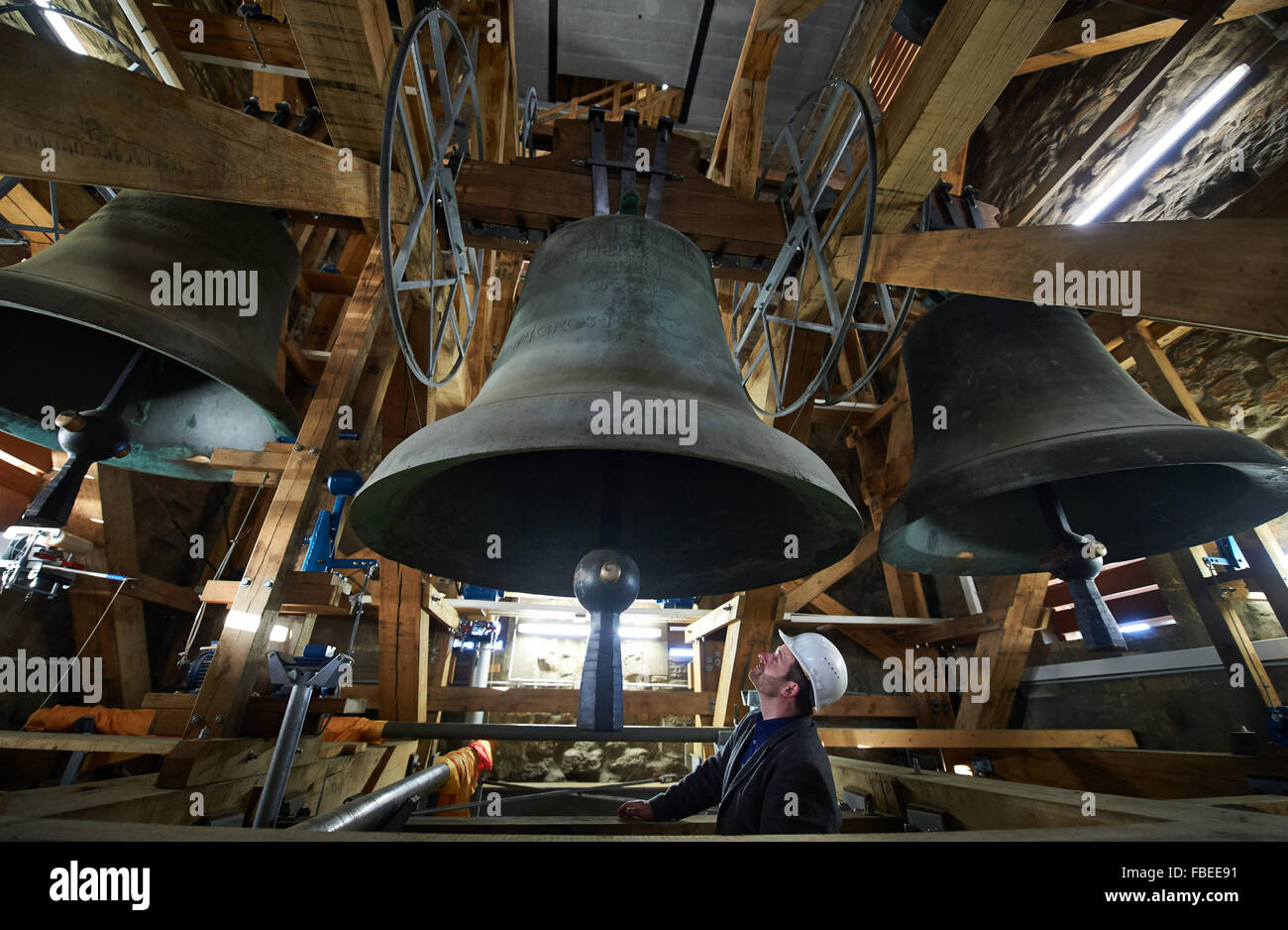 A view of massive church bells hanging from the bell tower of Muenster