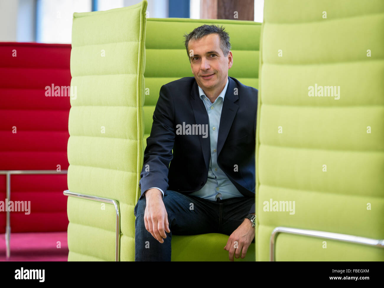 Chairman of the management board of chocolate manufacturer Ritter Sport, Andreas Ronken, sits in a seating area as he is pictured at the company headquarter in Waldenbuch, Germany, 8 December 2015. Photo: Daniel Maurer/dpa Stock Photo