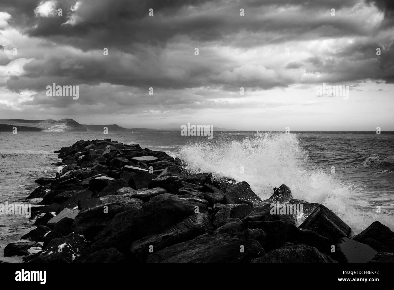 Waves crashing on the rocks at Lyme Regis, Dorset Seascape Stock Photo