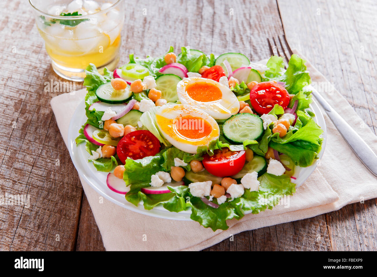 salad with egg tomato cucumber chickpeas cheese Stock Photo