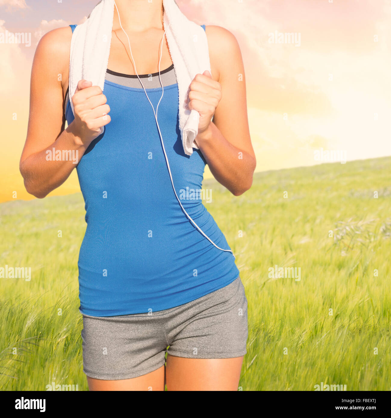 Composite image of fit woman with towel Stock Photo