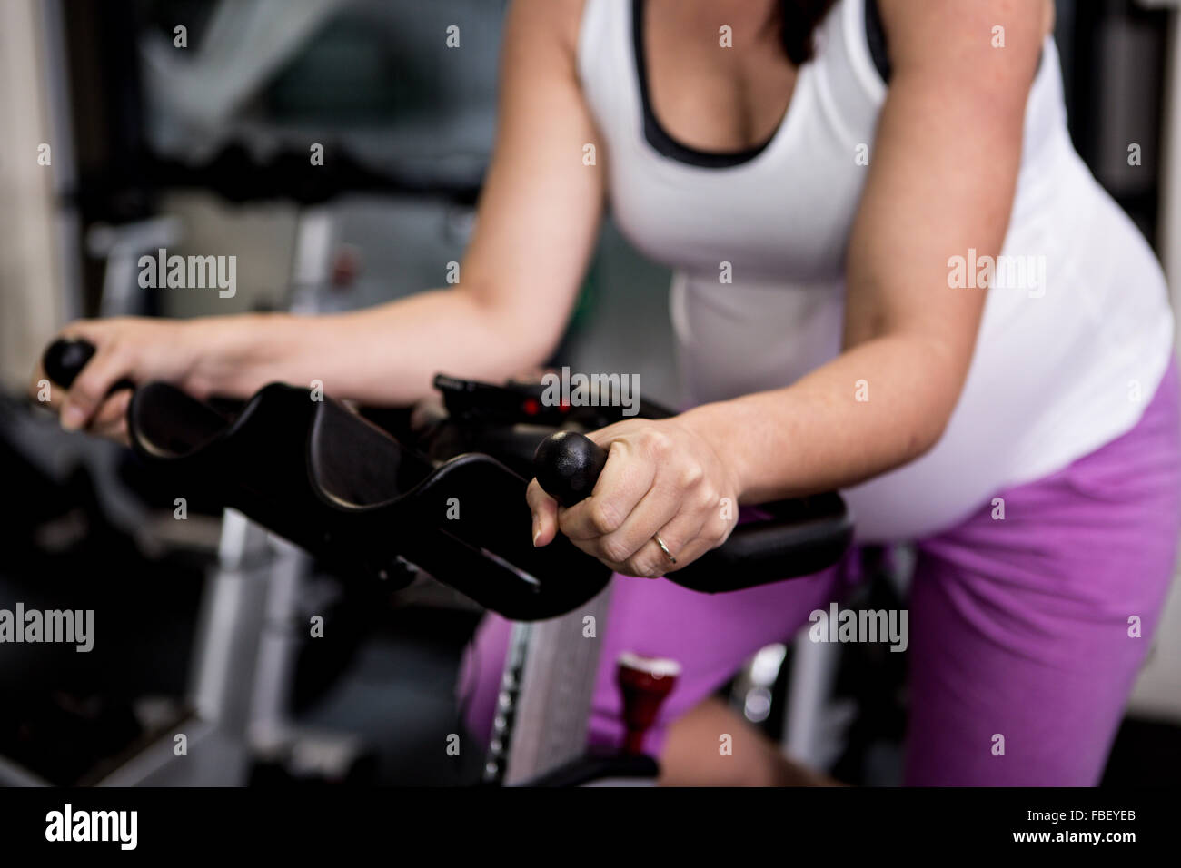 Pregnant woman riding bike Stock Photo Alamy