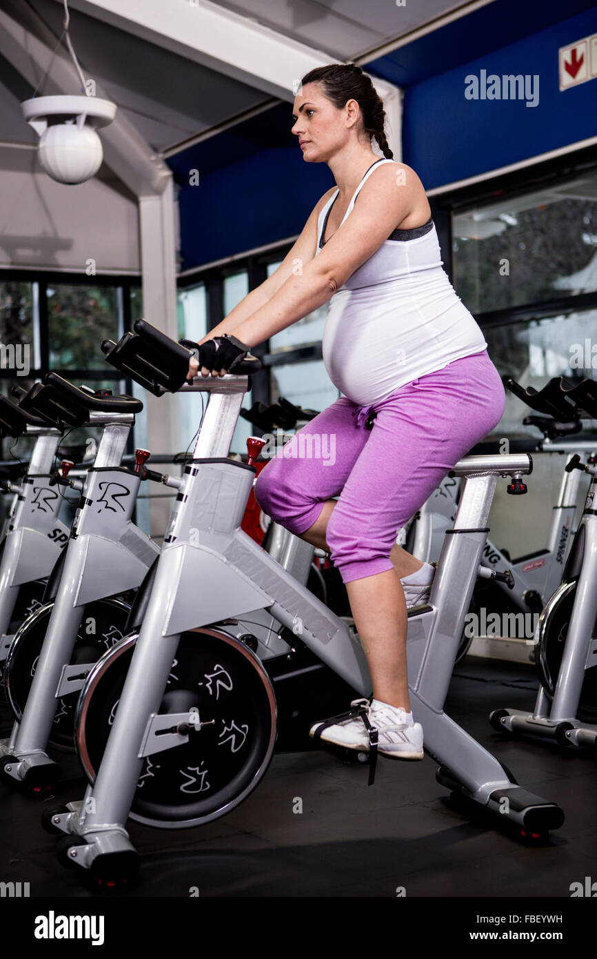 Pregnant woman riding bike Stock Photo Alamy