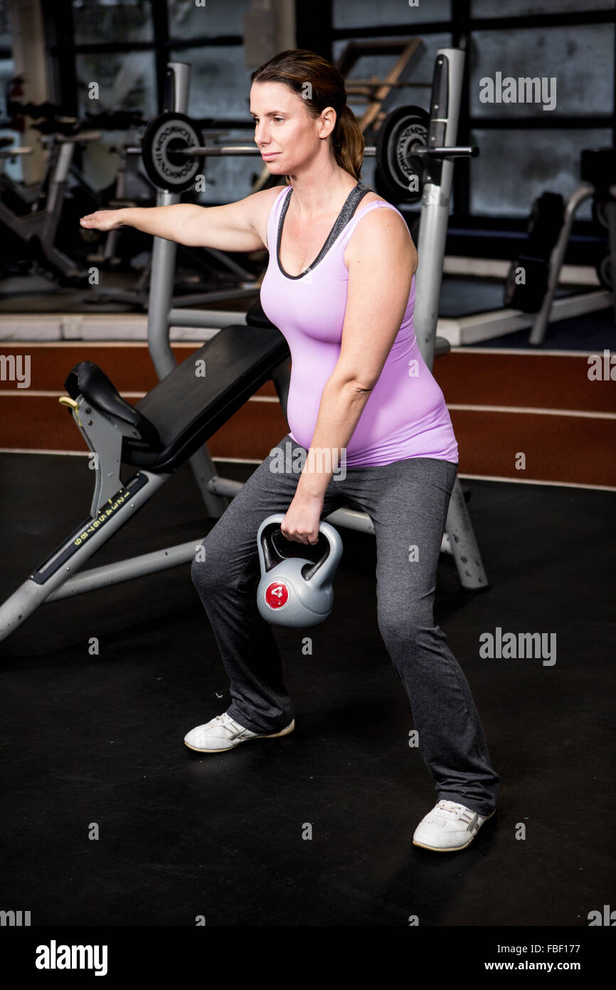 Pregnant woman lifting weights at the gym Stock Photo Alamy