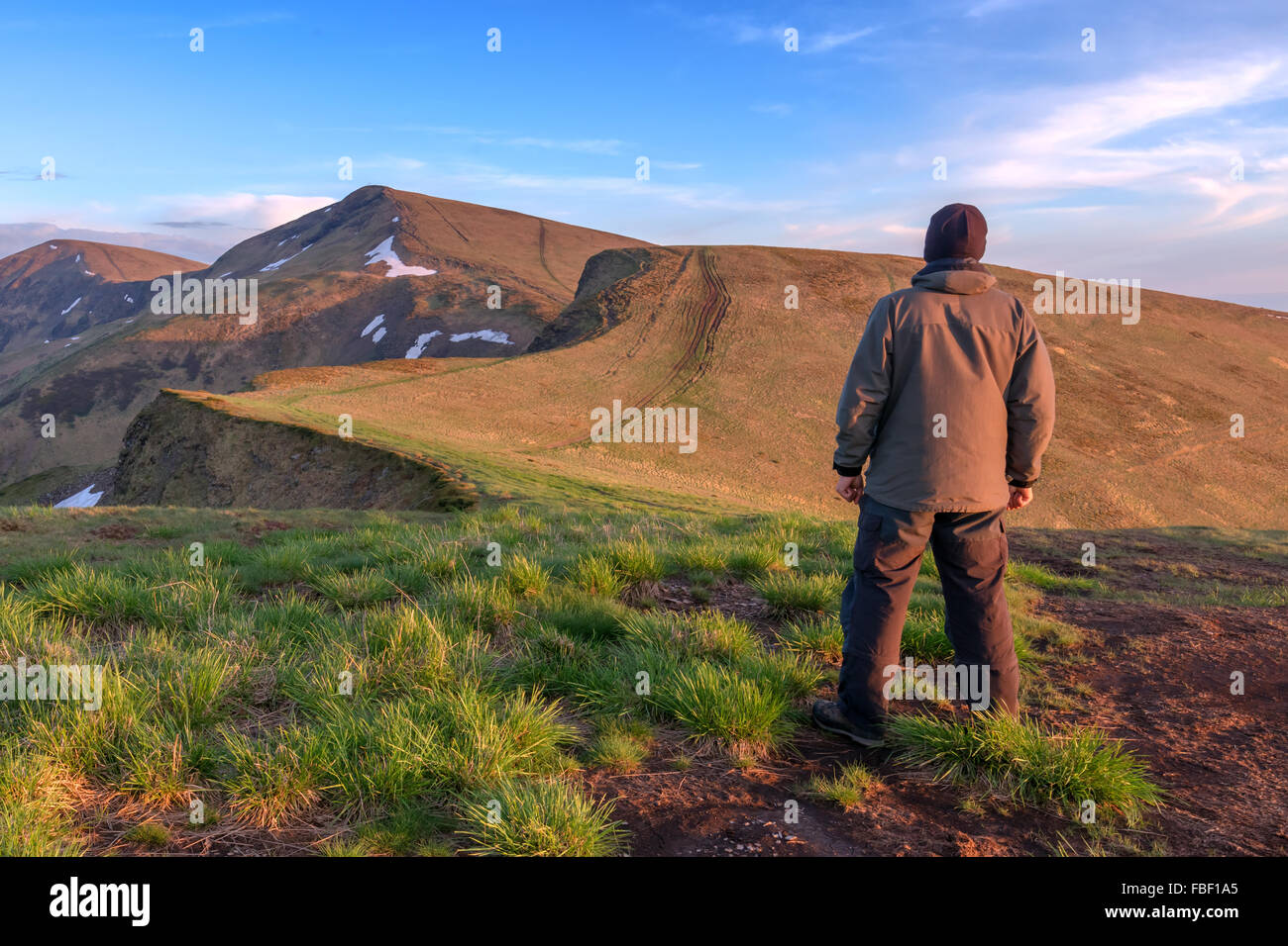 alone tourist on mountain top Stock Photo