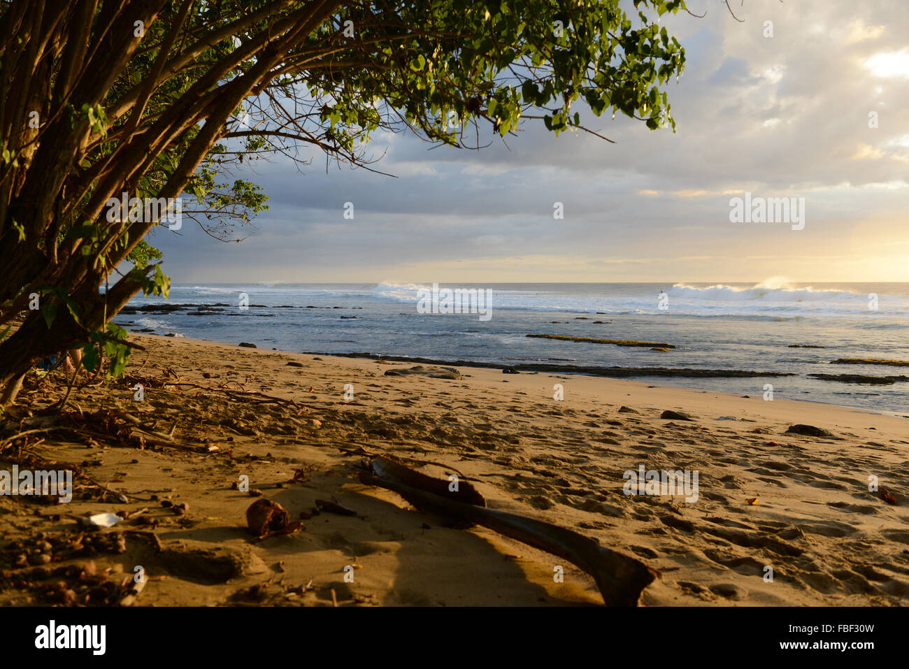 Sand, surfers and sunset at Maria's Beach. Rincon, Puerto Rico. USA territory. Caribbean Island. Stock Photo