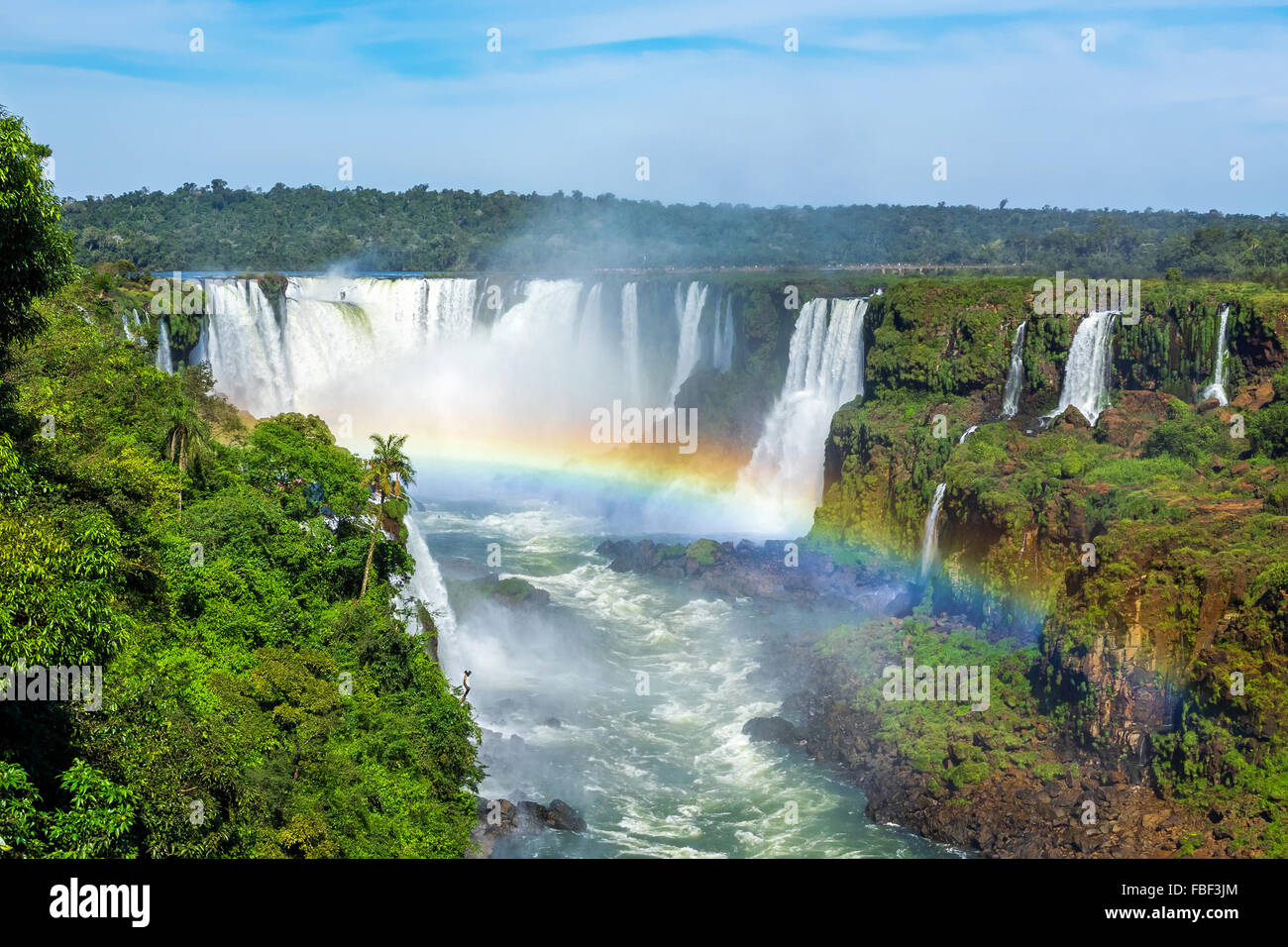 Rainbow at Iguazu Falls, on the border of Argentina and Brazil. Stock Photo