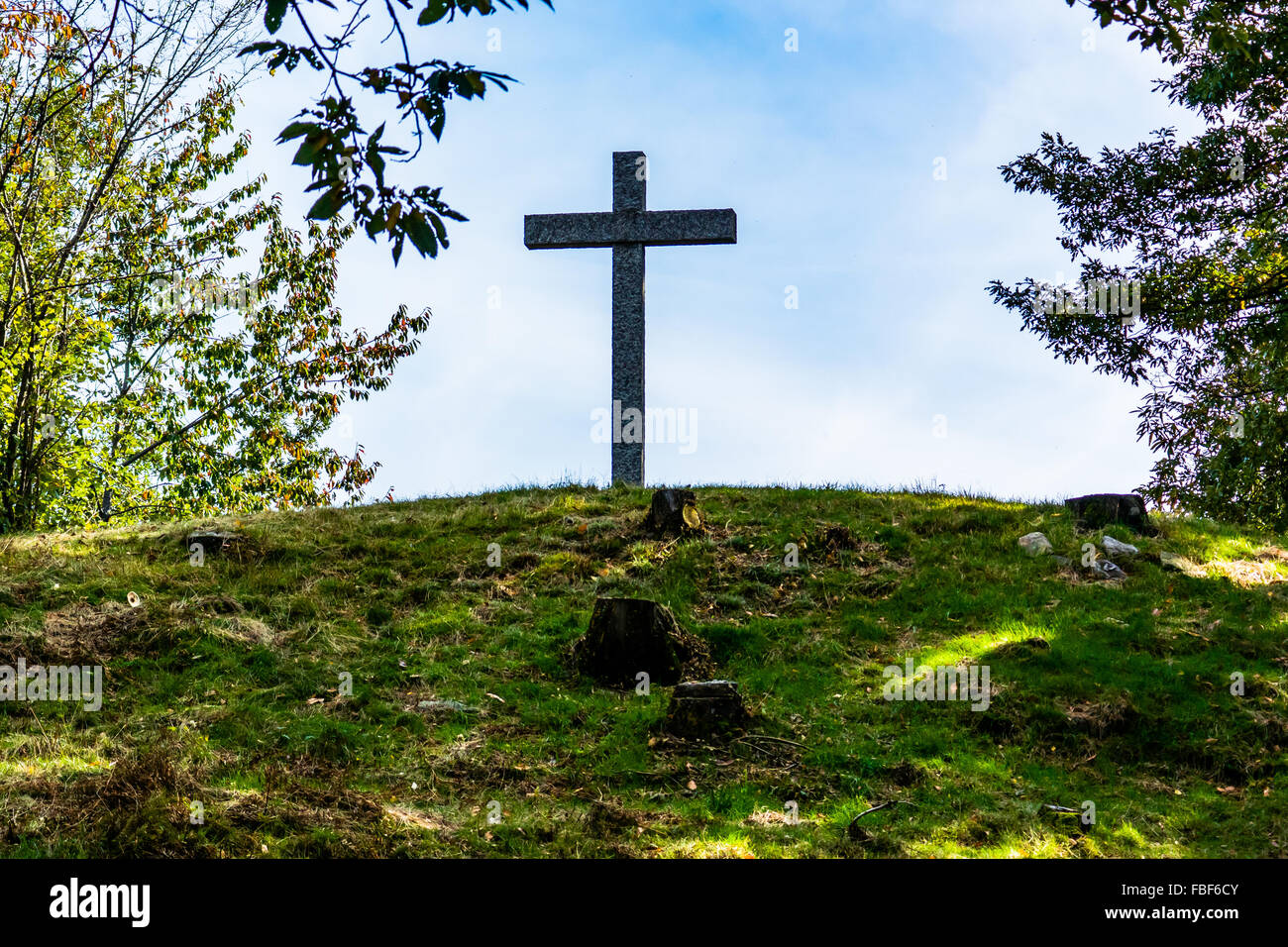 Low Angle View Of Cross On Field Against Sky Stock Photo