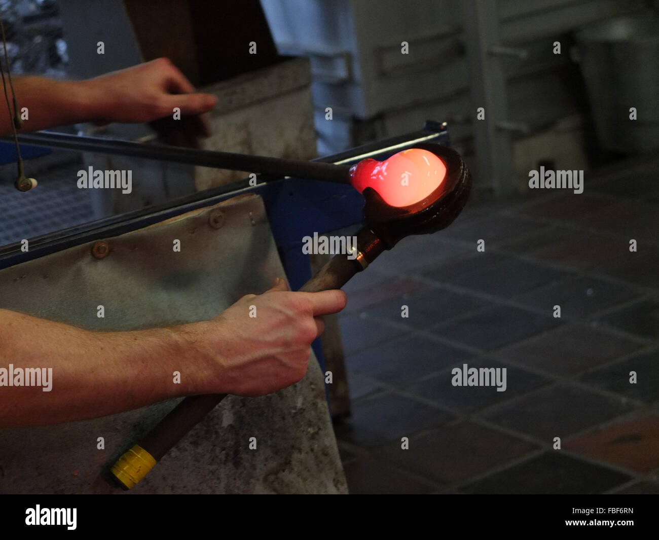 Cropped Hands Of Man Blowing Glass At Stock Photo Alamy