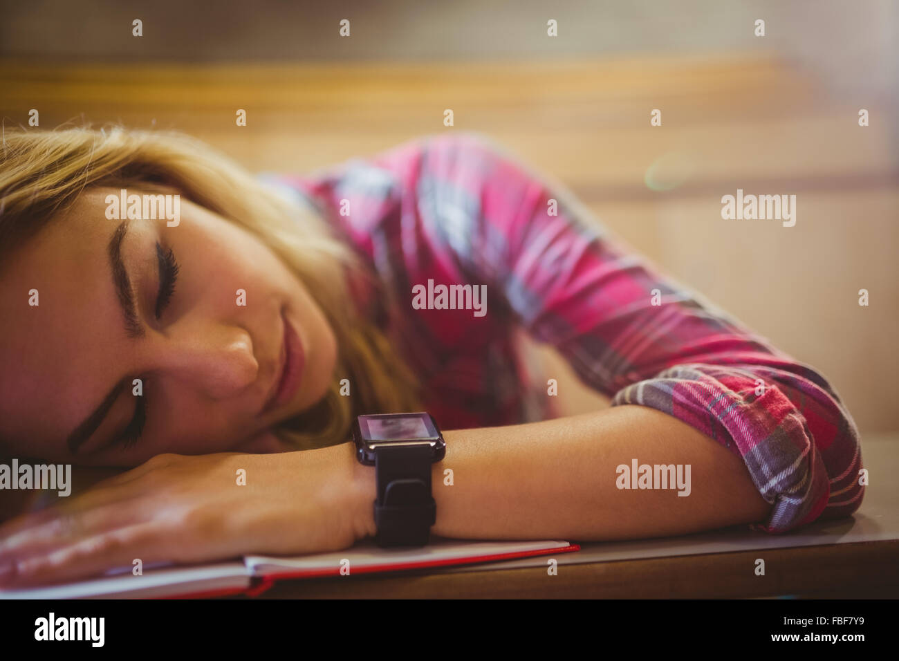 Attractive student sleeping during class Stock Photo