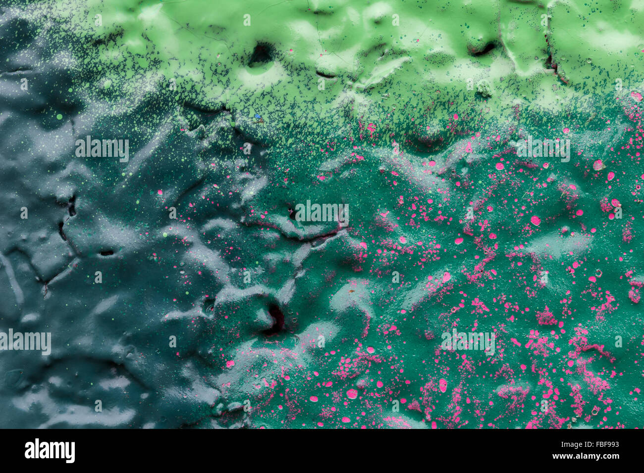 Macro close-up of colourful spray paints on a wall. Stock Photo