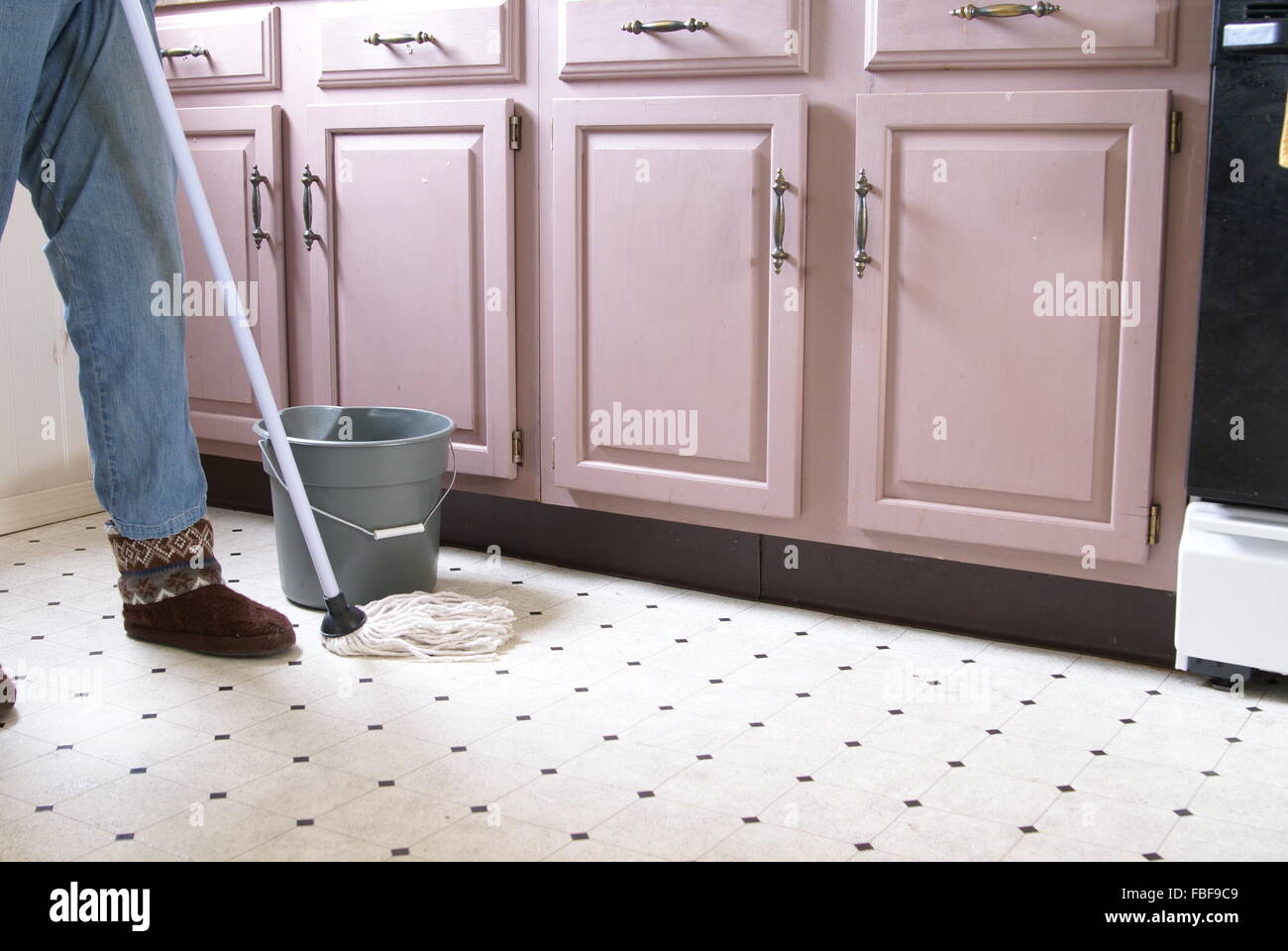 Mopping the kitchen floor Stock Photo Alamy