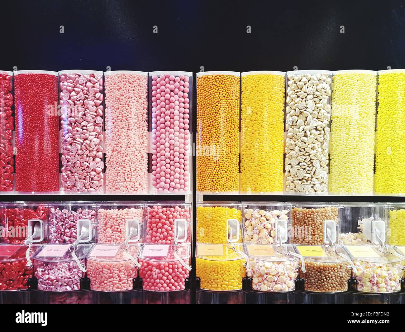 Row Of Candy Dispensers At Store Stock Photo