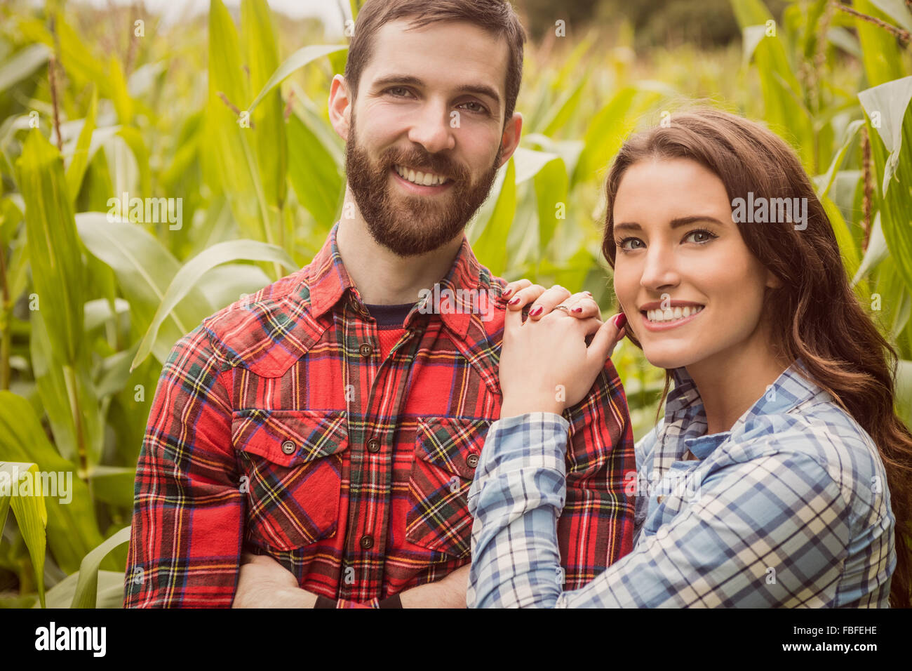 Smiling couple in a corn field Stock Photo - Alamy