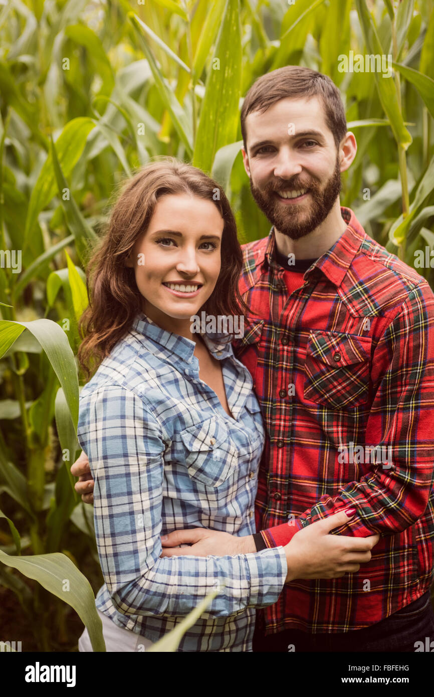 Smiling couple in a corn field Stock Photo - Alamy