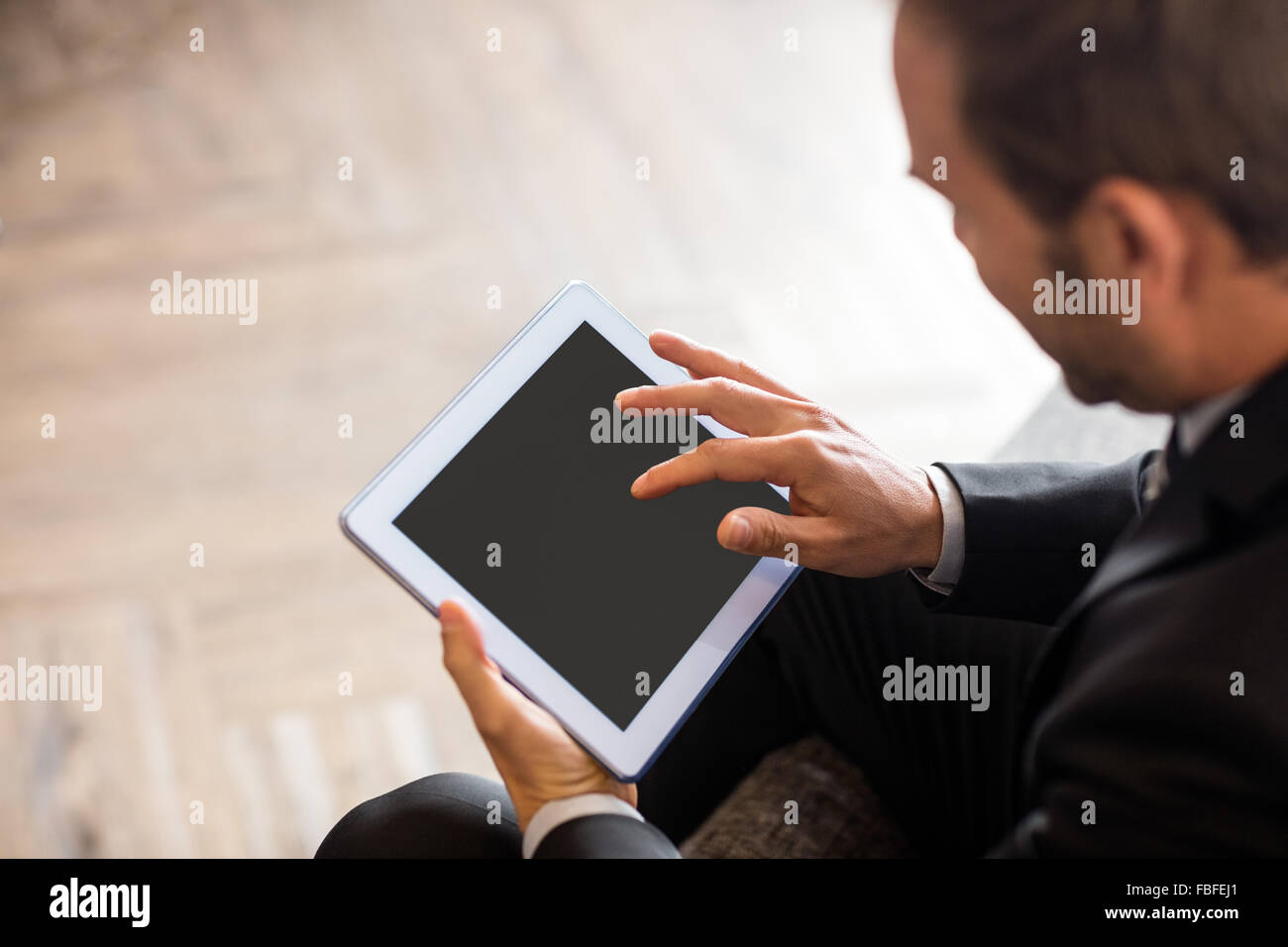 Businessman using tablet Stock Photo - Alamy