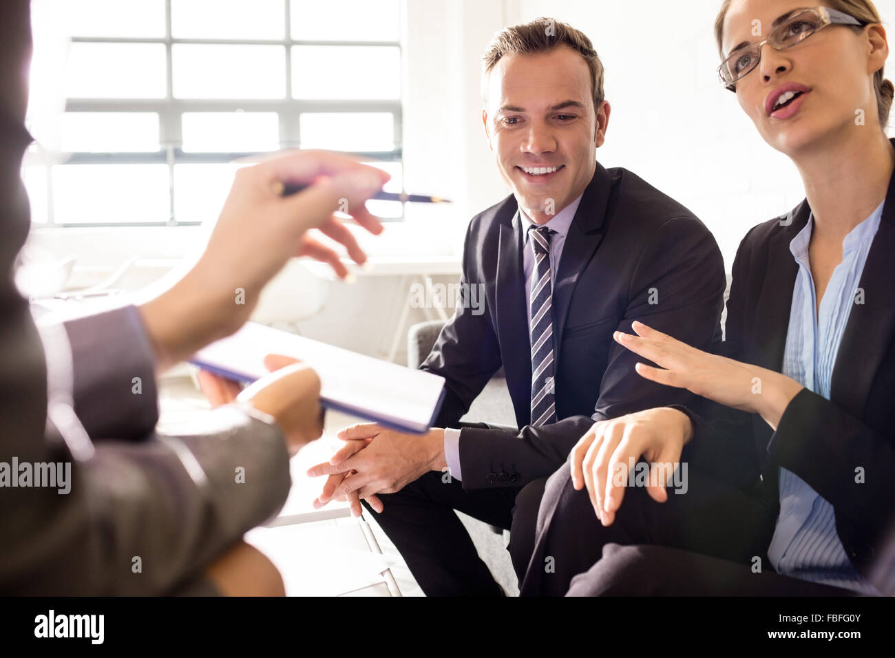 Colleagues having a conversation Stock Photo