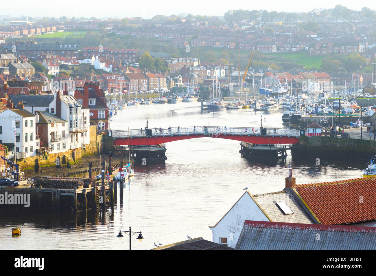 View down River Esk towards swing bridge and marina, Whitby, North Yorkshire, England, UK Stock Photo