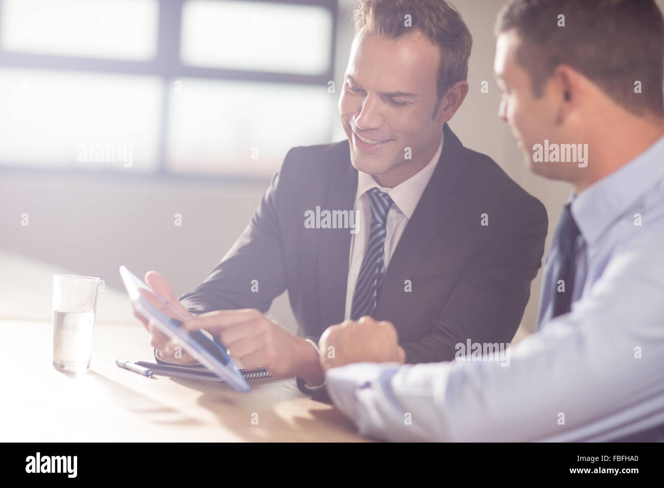Smiling business people working together Stock Photo - Alamy