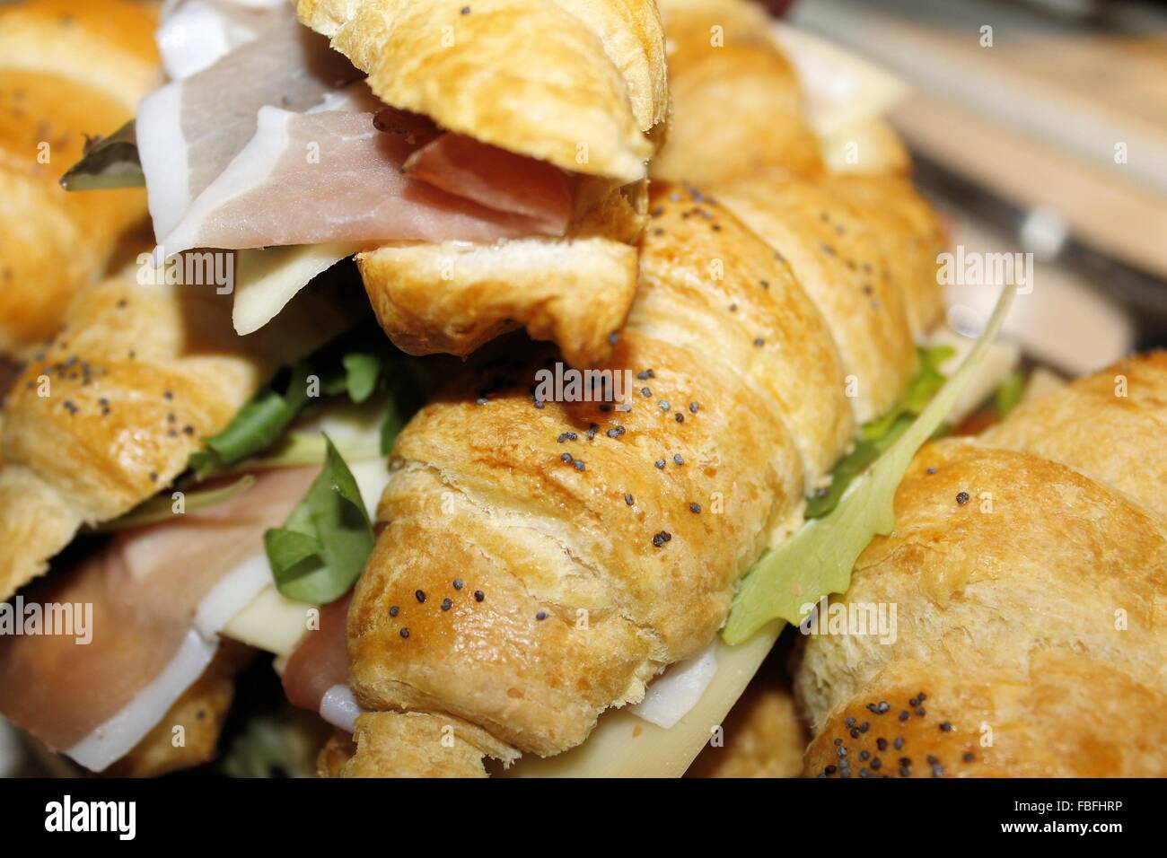small sandwiches filled with ham, cheese and lettuce Stock Photo