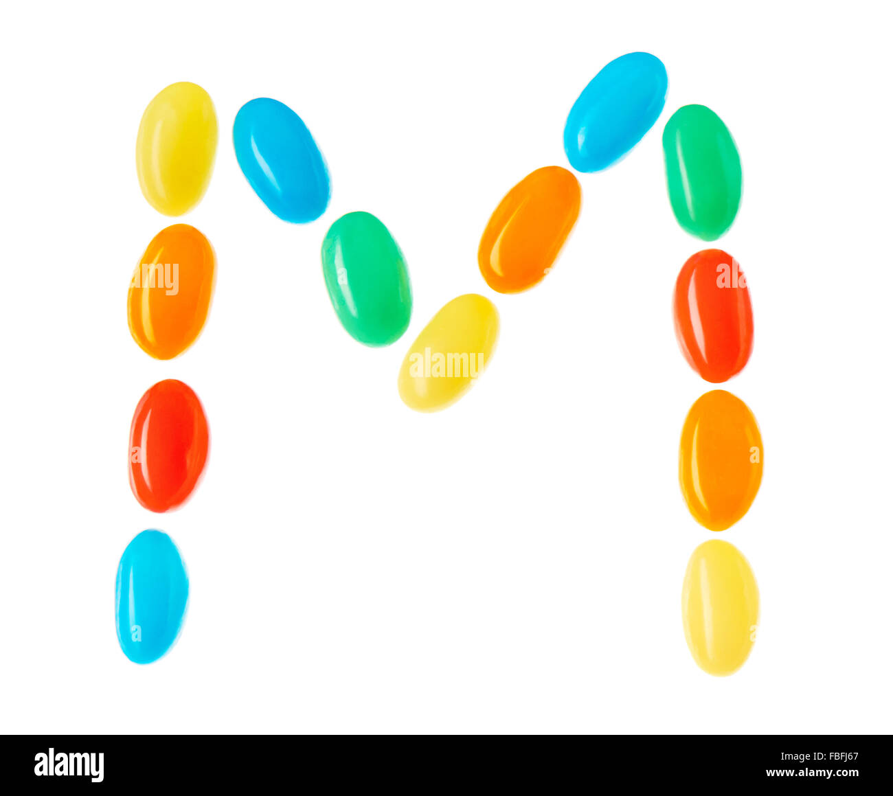 M letter made of multicolored candies isolated on white background Stock Photo