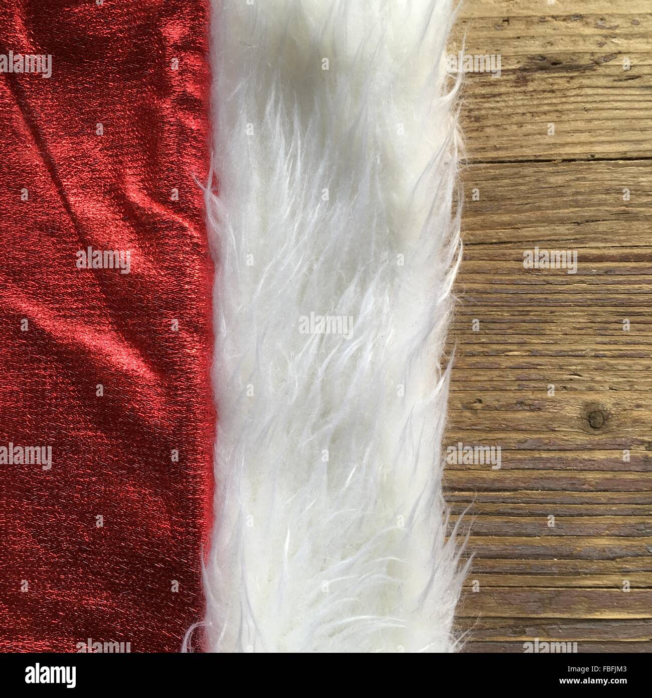 Cropped Image Of Santa Hat On Table Stock Photo