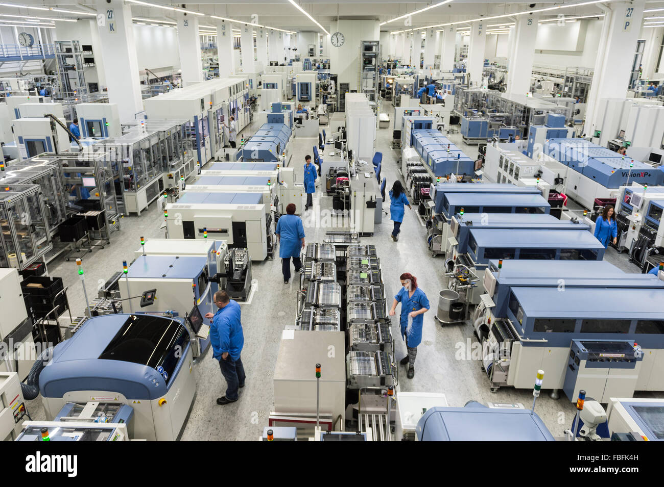 Amberg, Germany. 13th Jan, 2016. Employees are busy working on the