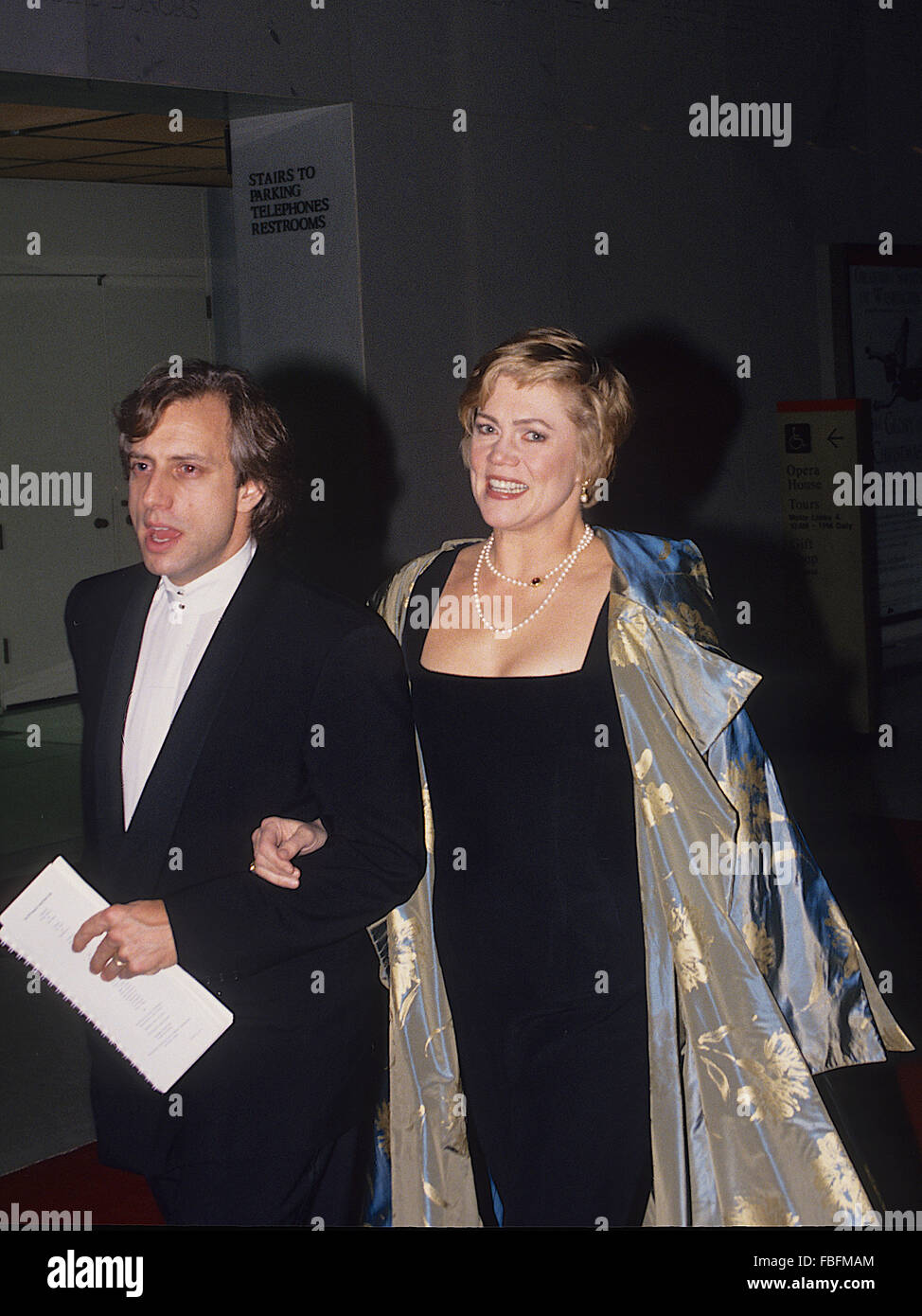 Washington, DC., USA, 5th December, 1993 Kathleen Turner and her husband Jay Weiss arrive at the Kennedy Center Honors.  Mary Kathleen Turner, better known as Kathleen Turner, is an American film and stage actress and director. Turner came to fame during the 1980s, after roles in Body Heat (1981), Romancing the Stone (1984), and Prizzi's Honor (1985), the latter two earning her a Golden Globe Award for Best Actress.  Credit: Mark Reinstein Stock Photo