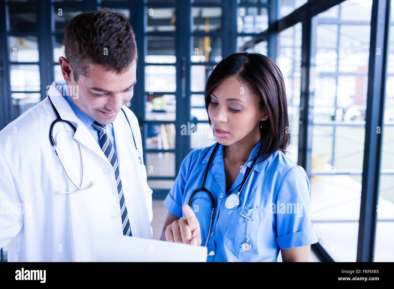 Nurse and doctor looking at files Stock Photo