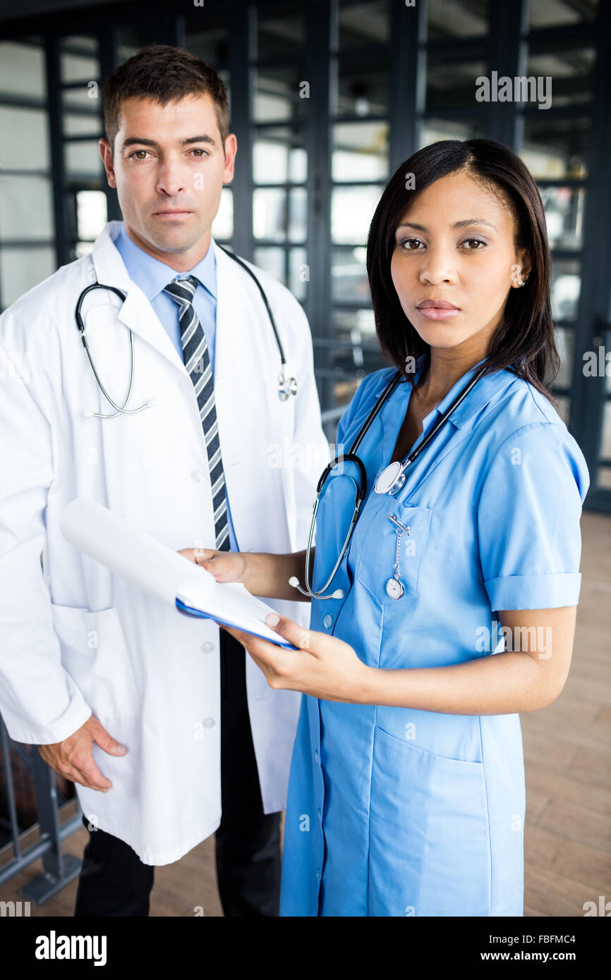Doctor nurse looking documents hi-res stock photography and images - Alamy