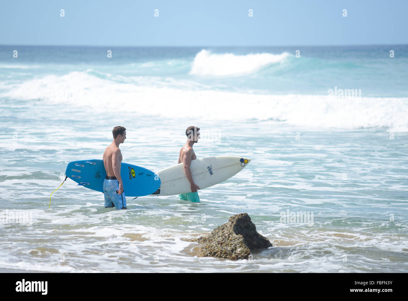 Surfers at Dome's Beach. Rincon, Puerto Rico. USA territory. Caribbean Island. Stock Photo