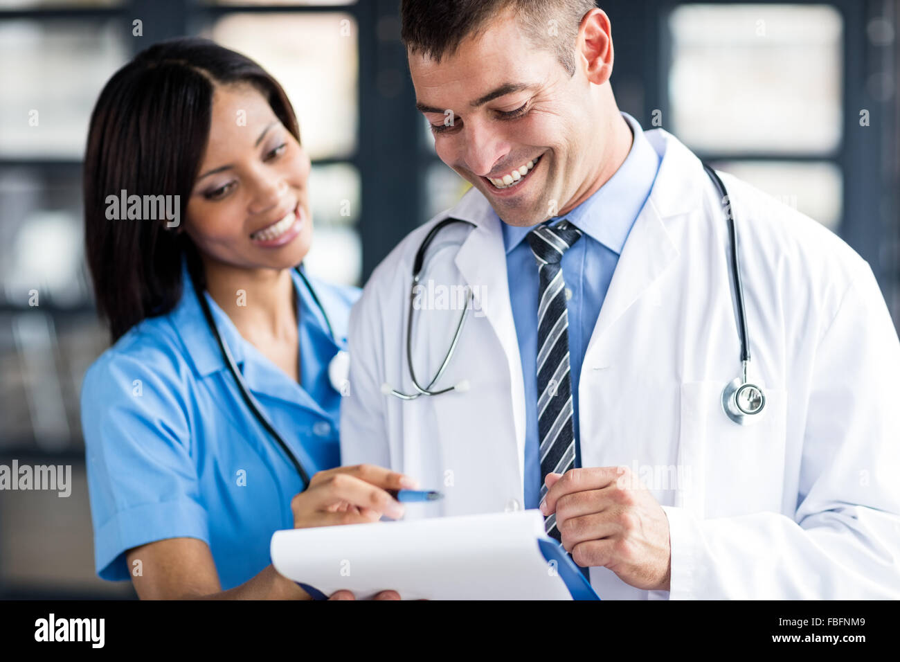Nurse and doctor smiling Stock Photo Alamy