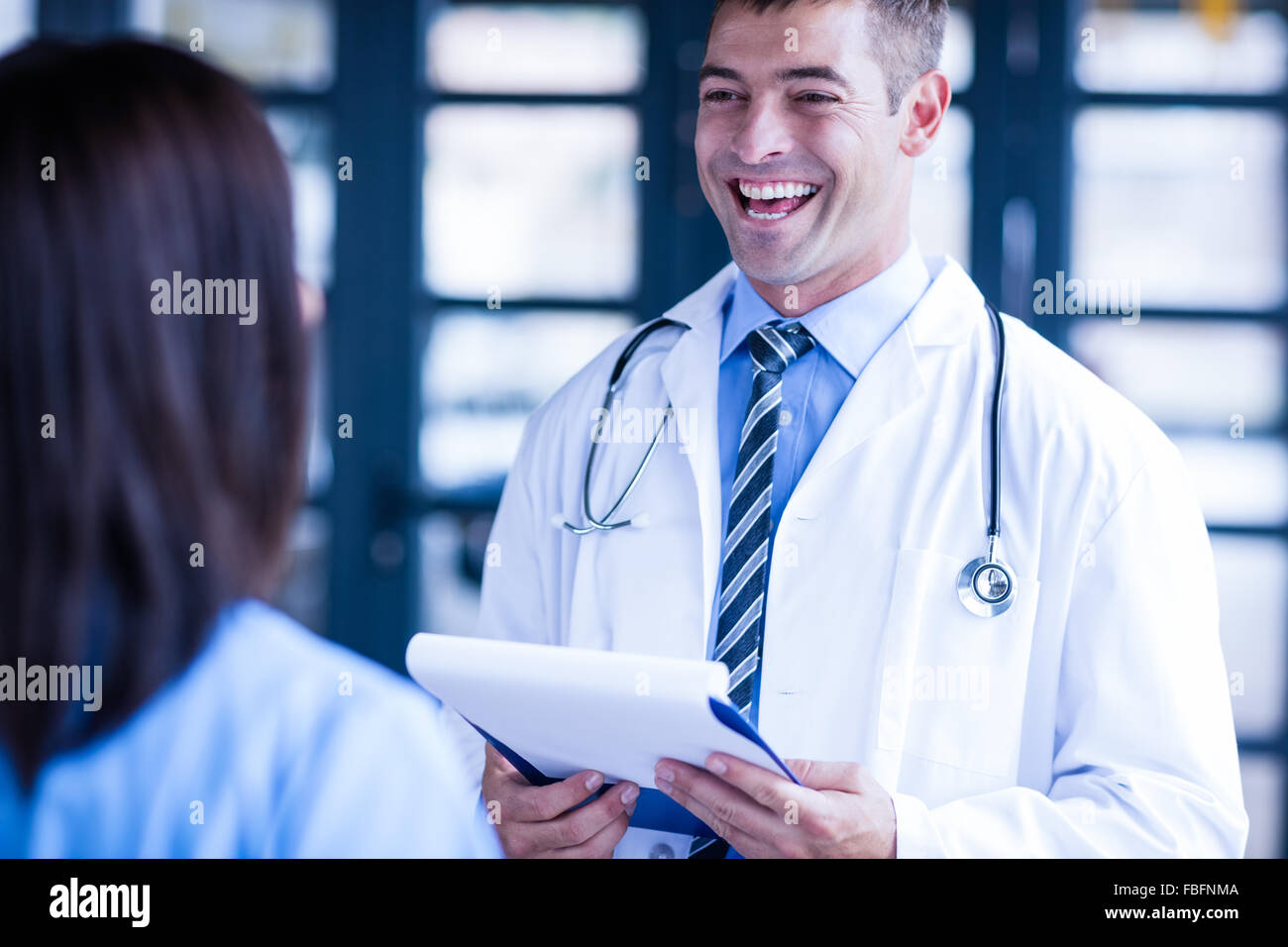 Nurse and doctor smiling Stock Photo Alamy