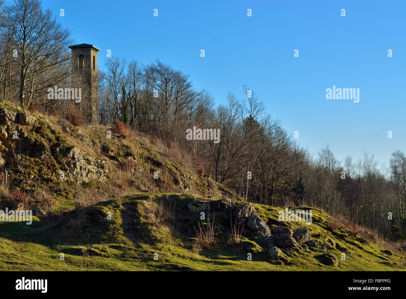 The 'Pepper Pot' at Brown's Folly. Brown's Folly standing in a former quarry showing grazed unimproved grassland Stock Photo