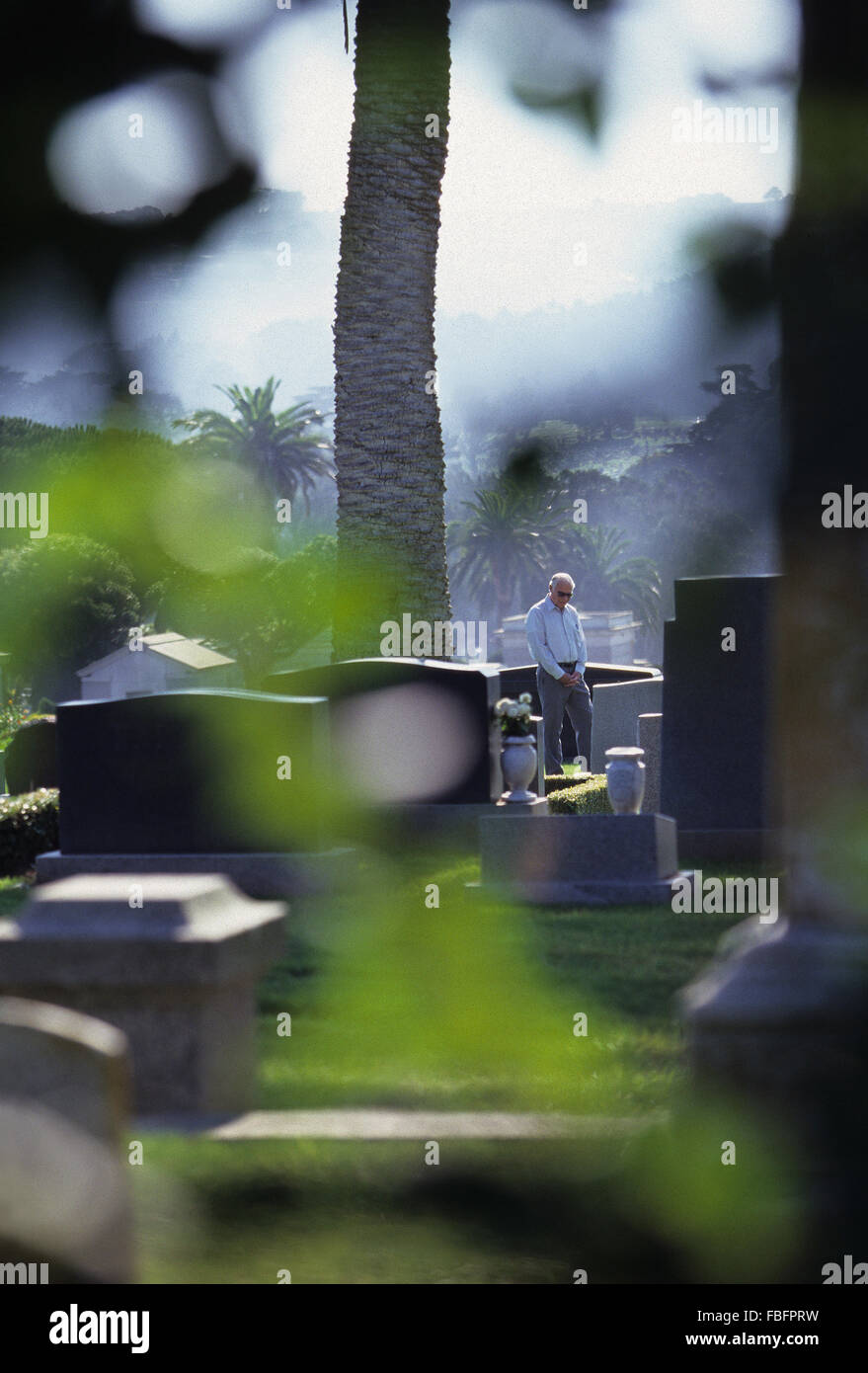 man at Colma cemetery California Stock Photo