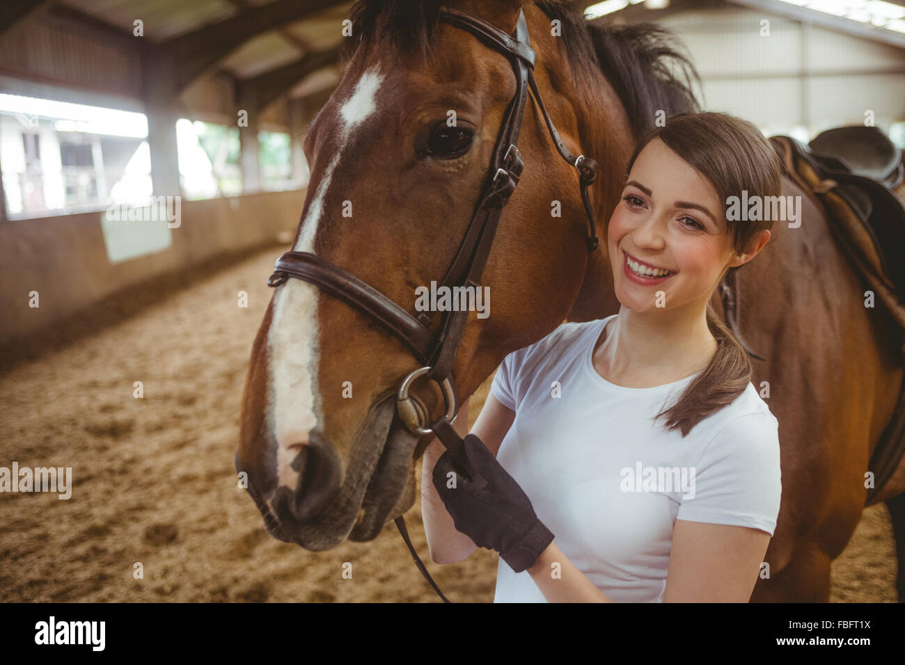 Female rider leading her horse Stock Photo - Alamy