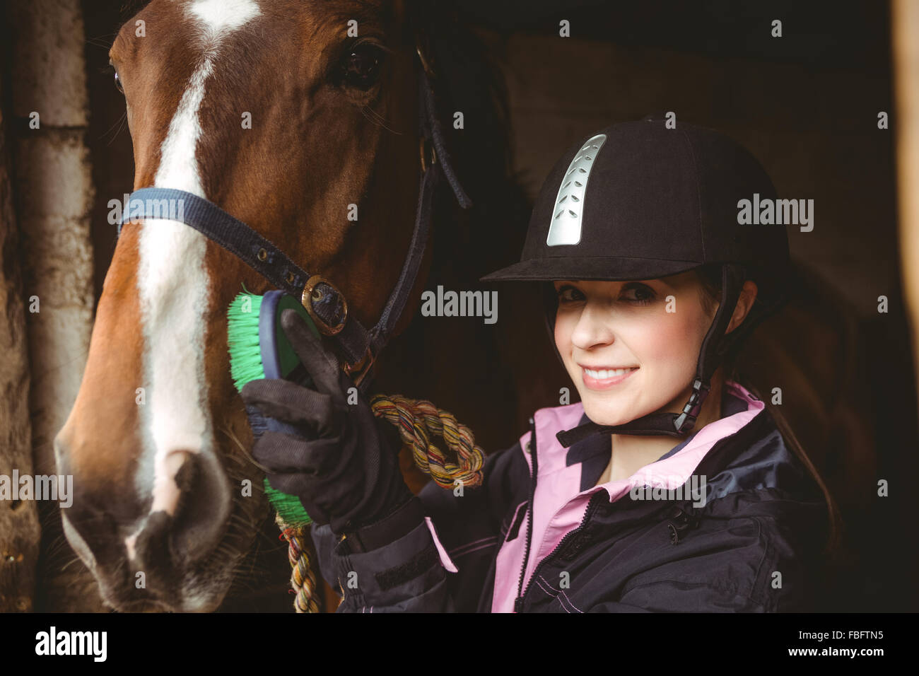 Female rider leading her horse Stock Photo - Alamy