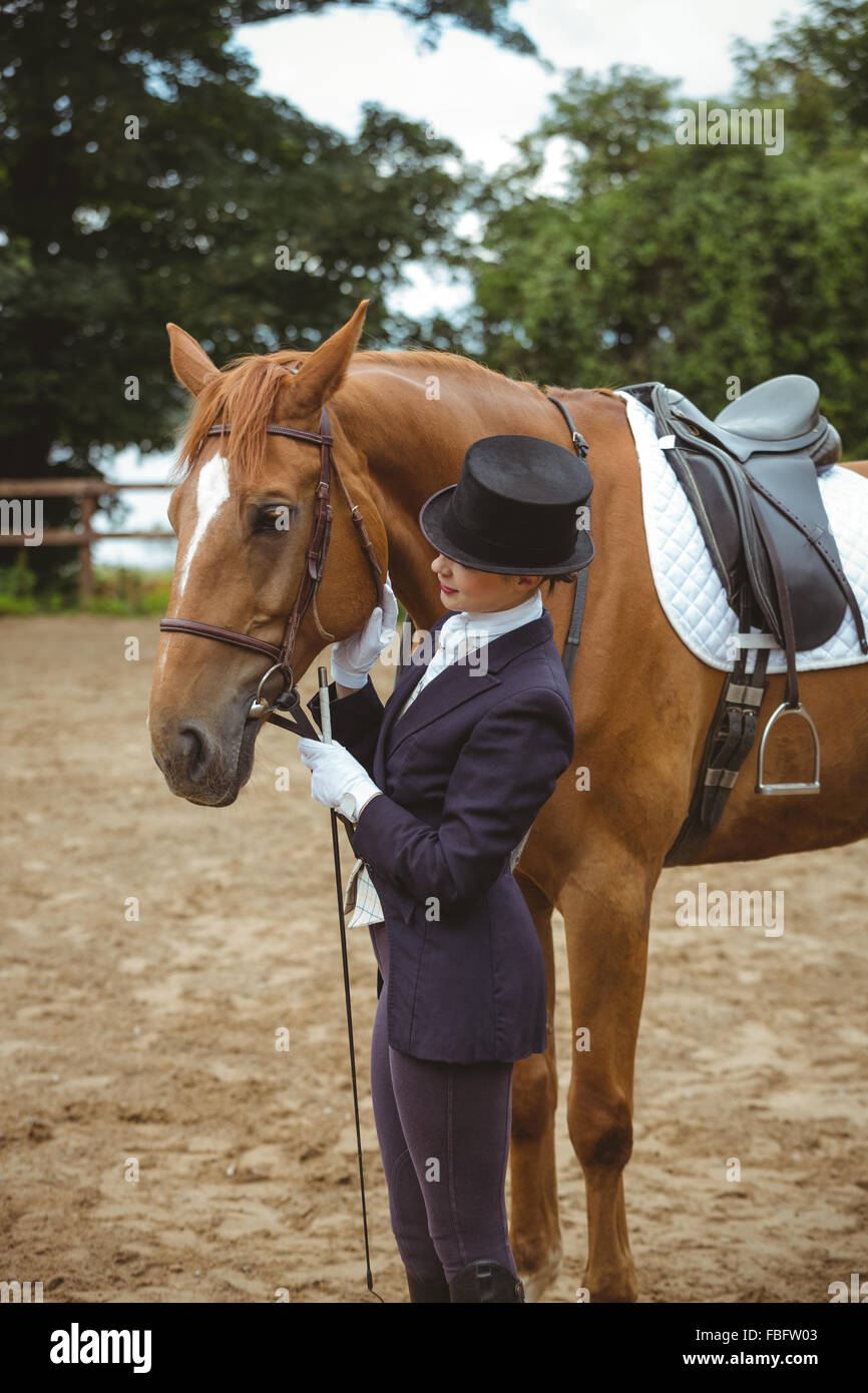 Female jockey leading her horse Stock Photo Alamy