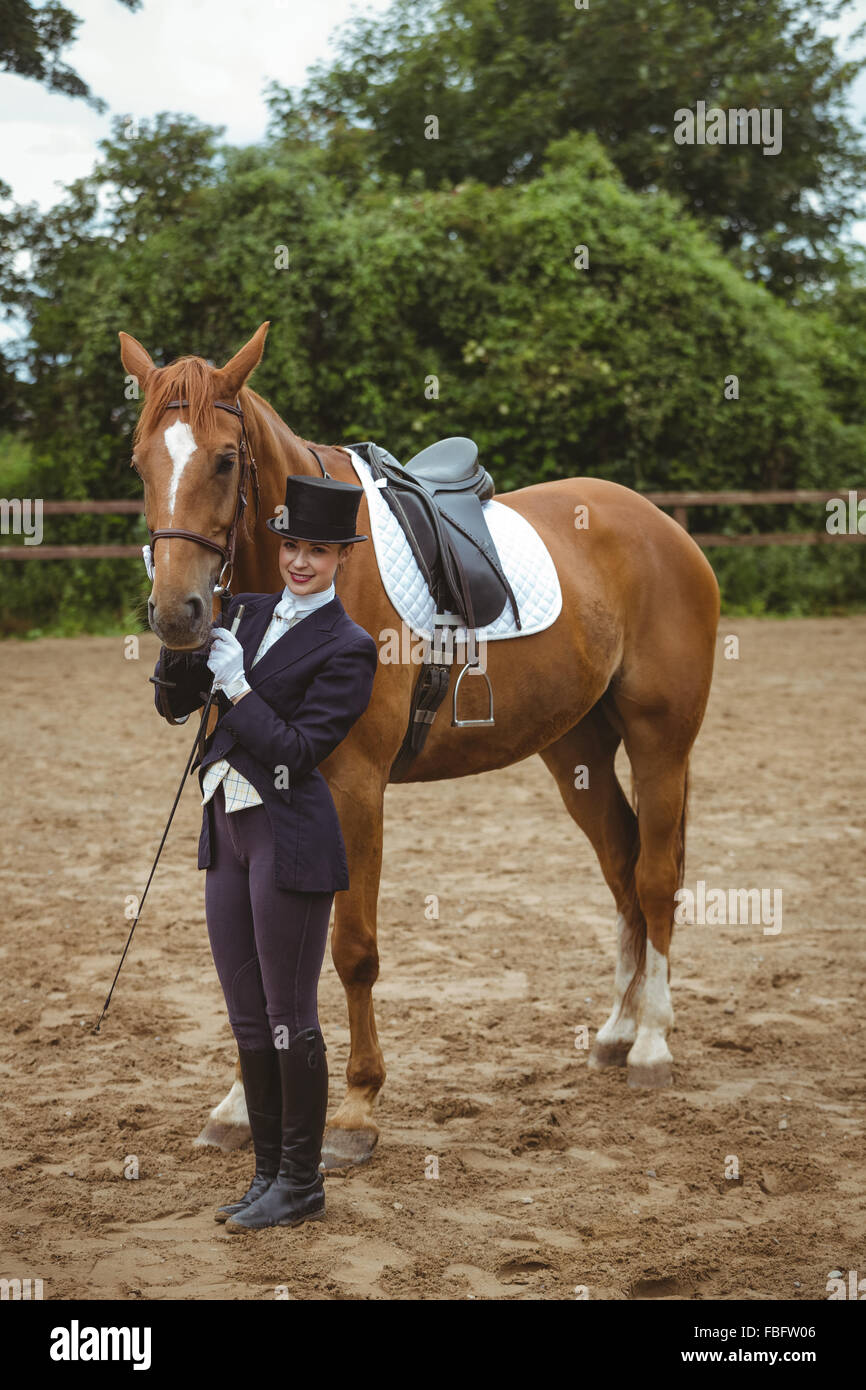 Female jockey leading her horse Stock Photo Alamy