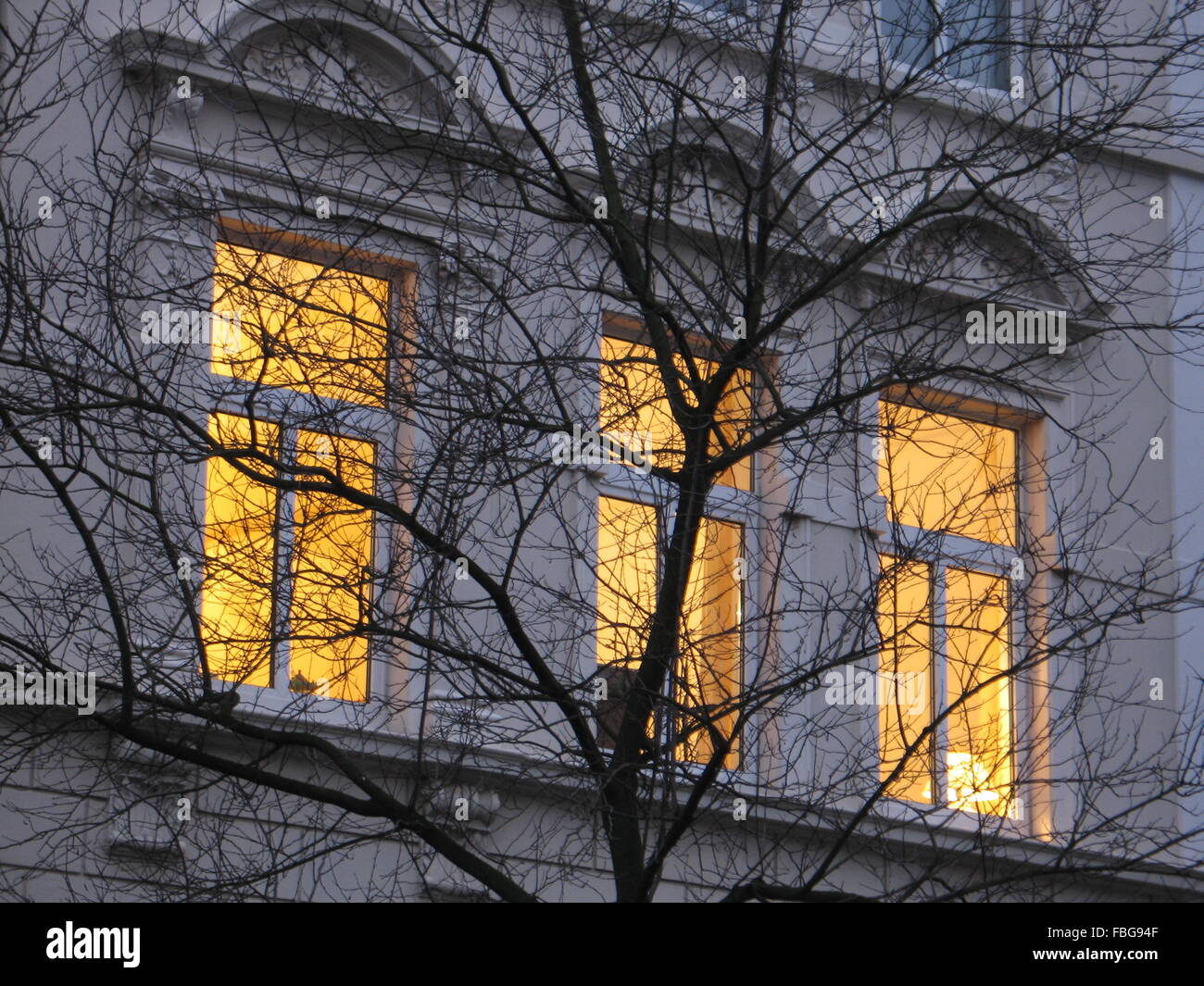 windows with light in the evening Stock Photo