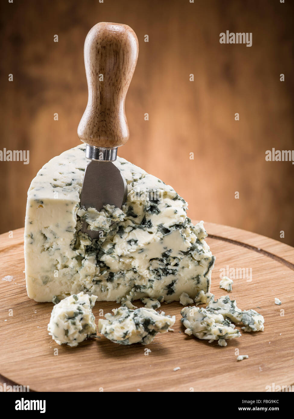 Danish blue cheese on a wooden board. Stock Photo